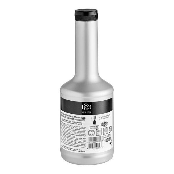 A silver 1883 Maison Routin bottle with a black label.