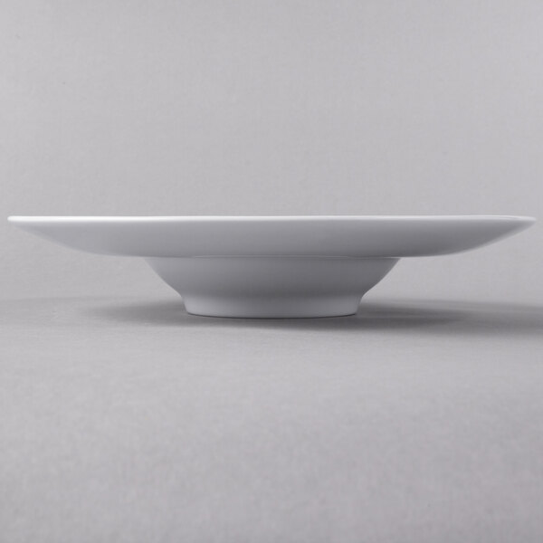 A close up of a white Libbey Slenda Super Bowl on a gray surface.