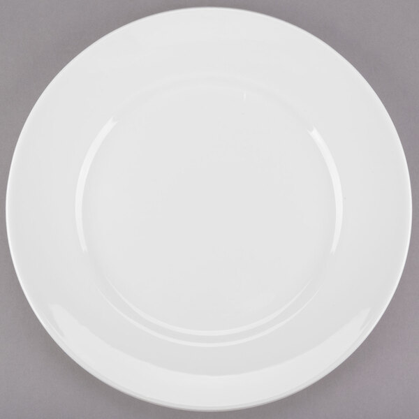 A white Libbey Slenda round porcelain plate with a wide rim.