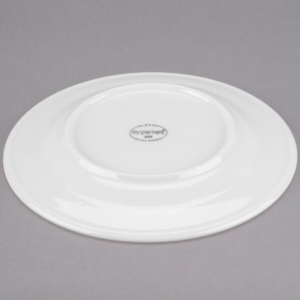 A white Libbey porcelain plate with a wide circular rim.