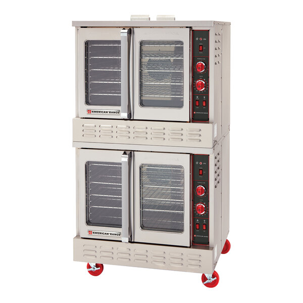 A double-deck electric convection oven with glass doors and red control knobs, mounted on red caster wheels.