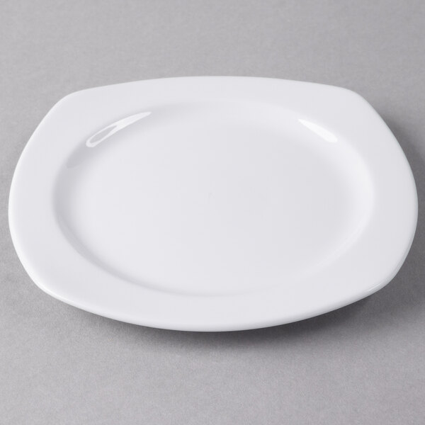 A white Libbey square porcelain plate on a gray surface.