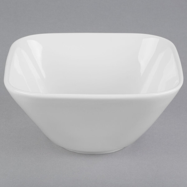 A white square bowl with a curved edge.