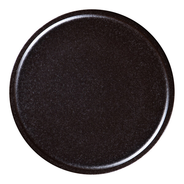 A black RAK Porcelain Forge flat coupe plate with a shiny surface on a white background.