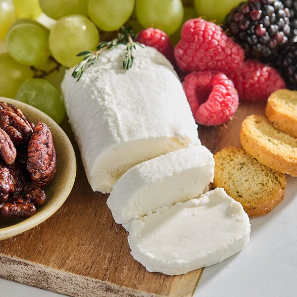A cheese and fruit board with Celebrity goat cheese, grapes, and berries.