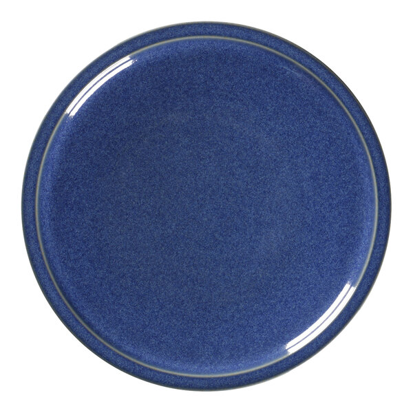 A cobalt blue RAK Porcelain plate with a white border.
