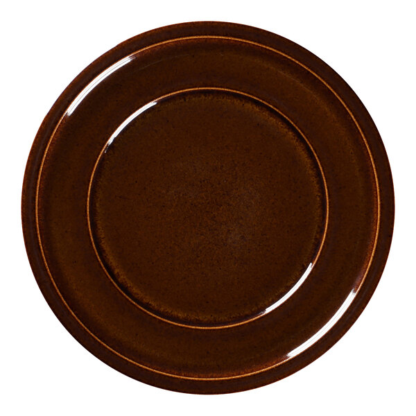 A brown porcelain plate with a white rim.