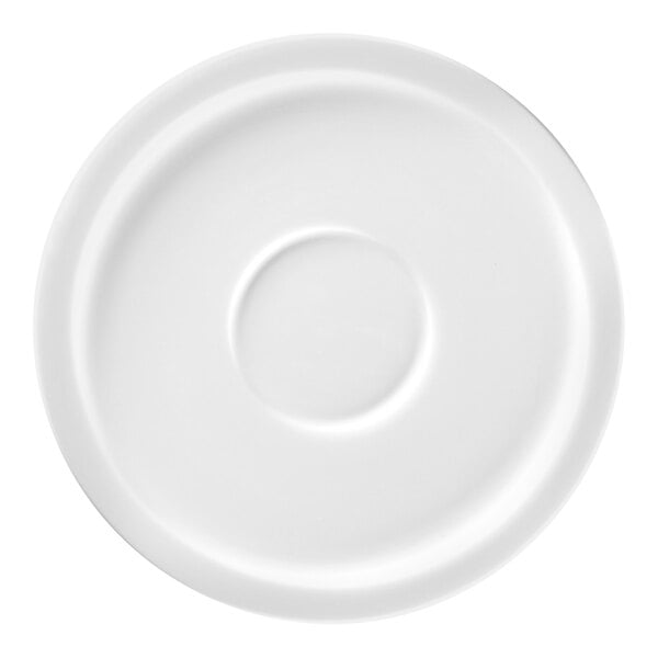 A white saucer with a circular indention in the middle.