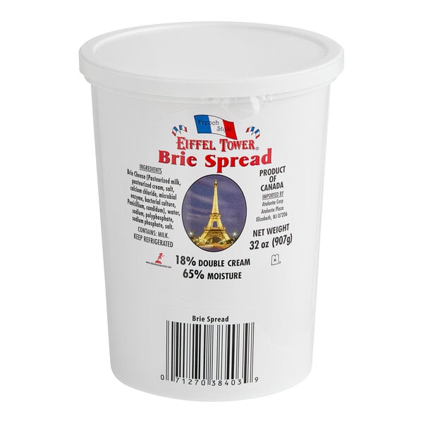 A white Eiffel Tower Brie Cheese Spread container.