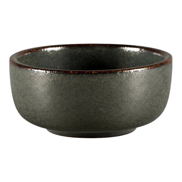 A close-up of a Porcelain Ease ramekin with a dark gray rim.