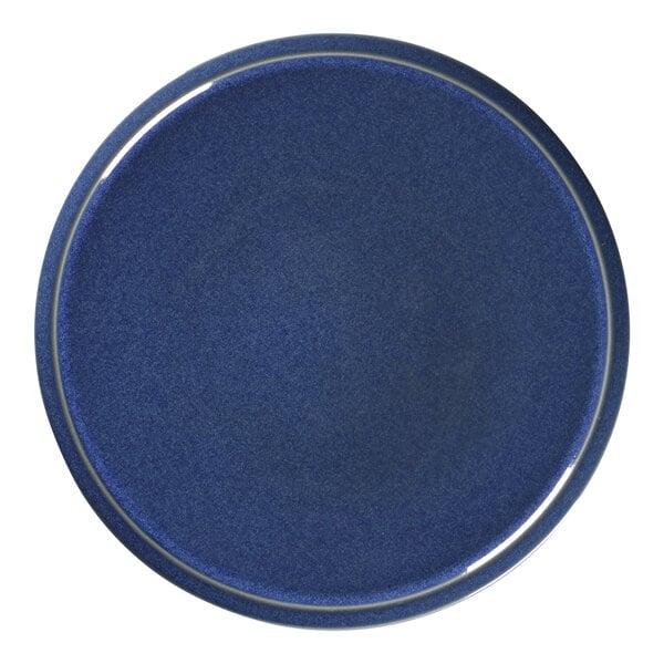 A blue RAK Porcelain plate with a white rim.