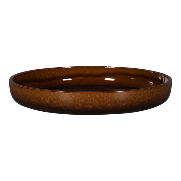 A brown porcelain plate with a rim on a white background.