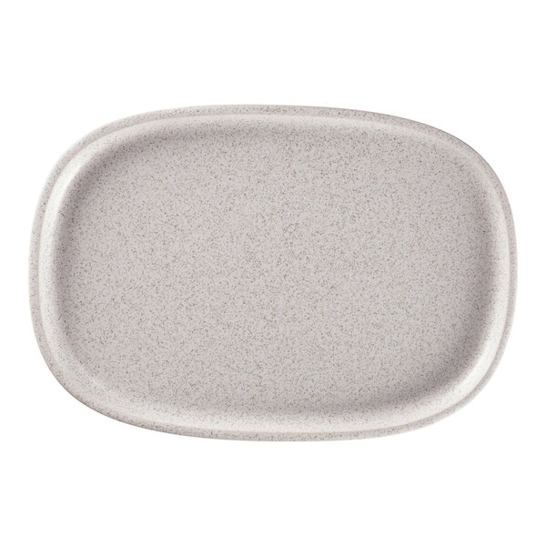 A white oval RAK Porcelain plate with a speckled surface.