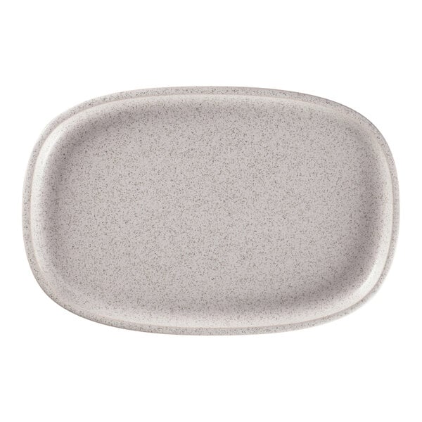 A white oval RAK Porcelain plate with speckled specks.