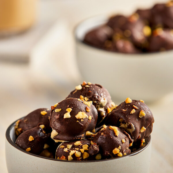 A bowl of Eclipse Foods Bonbons, chocolate covered almond ice cream bites.