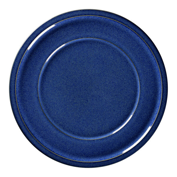 A RAK Porcelain cobalt blue porcelain plate with a gold rim.