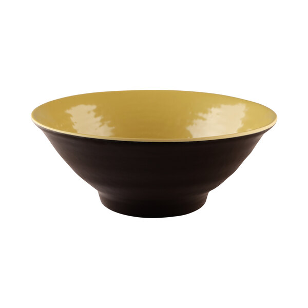 A close-up of an Elite Global Solutions bowl with a yellow rim and black lines.