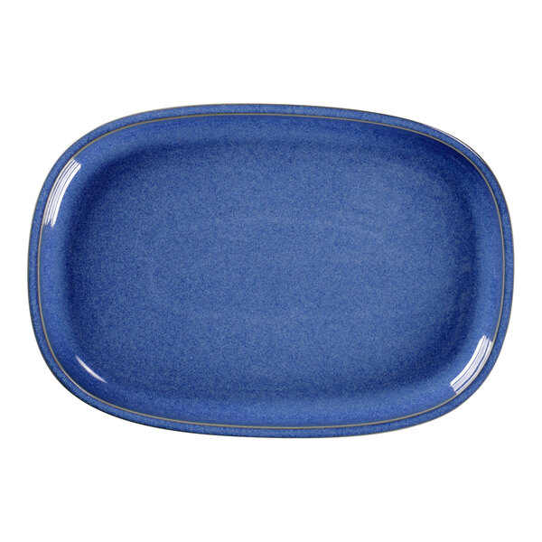 A blue oval RAK Porcelain plate with a gold rim.
