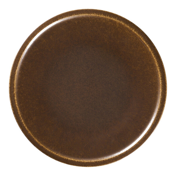 A close-up of a brown RAK Porcelain plate with a white background.