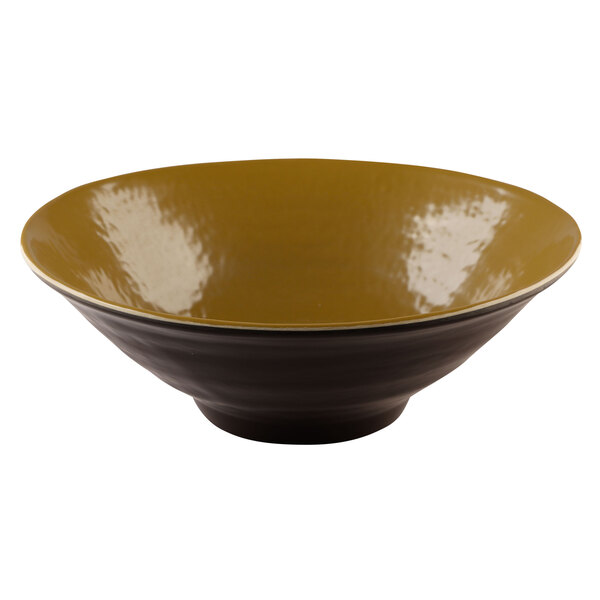 A white melamine bowl with a yellow rim.