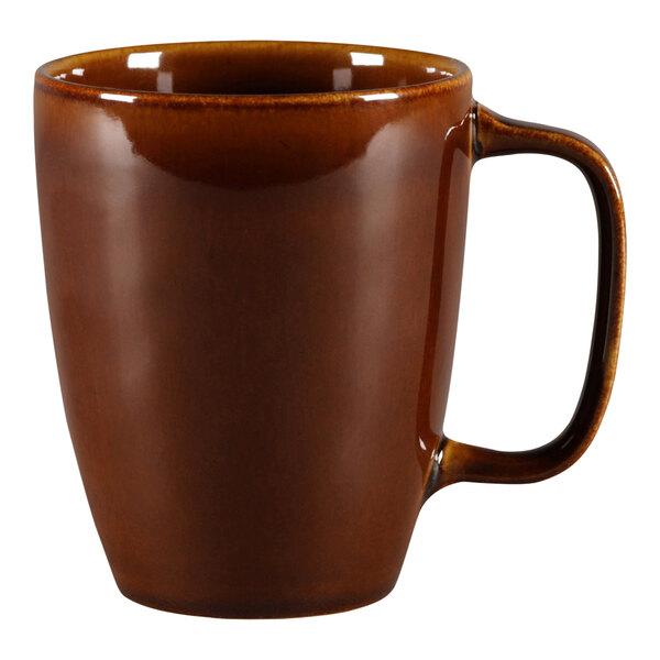 A brown RAK Porcelain mug with a handle.