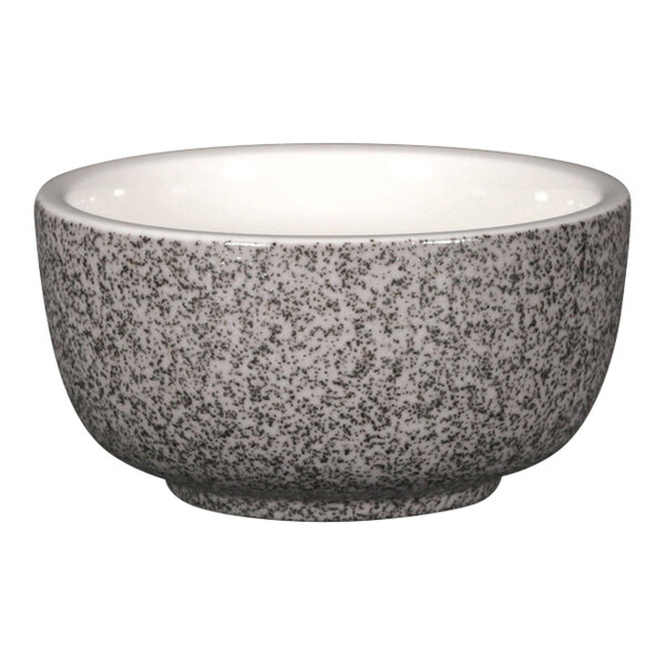 A white porcelain RAK ramekin with a black speckled design.