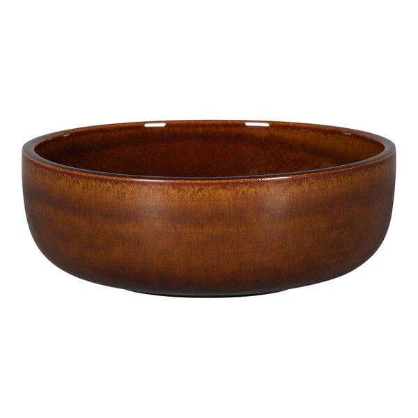 A brown RAK Porcelain bowl with a brown rim on a table.