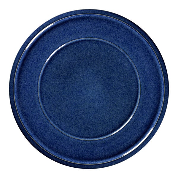 A cobalt blue porcelain plate with a rim.