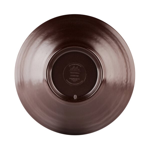 An Abyss-colored melamine bowl with a brown circle in the middle.