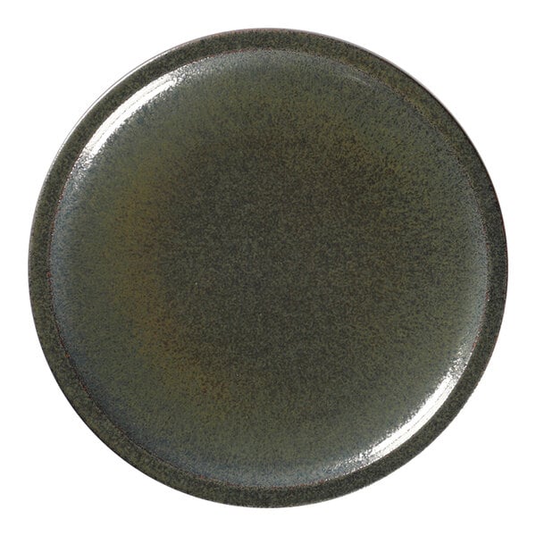 A close-up of a RAK Porcelain dark green Caldera plate with a brown rim.