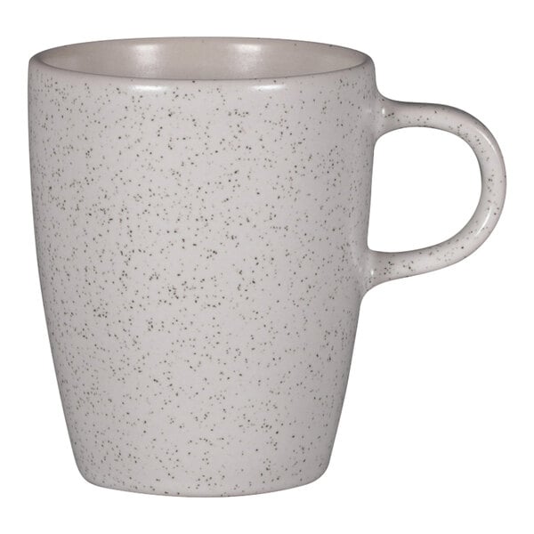 A RAK Porcelain white speckled coffee cup with a handle.