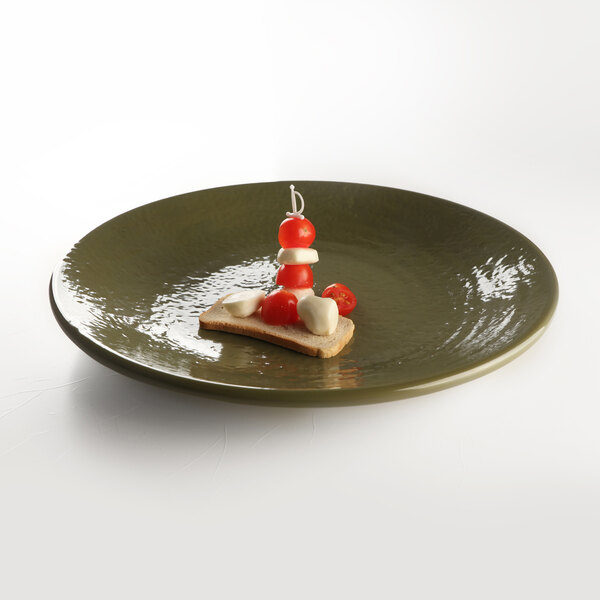 A Lizard-colored Elite Global Solutions round melamine plate with food on it.