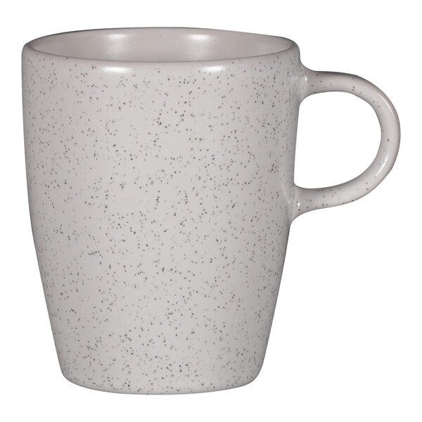 A RAK Porcelain white speckled coffee cup with a handle.