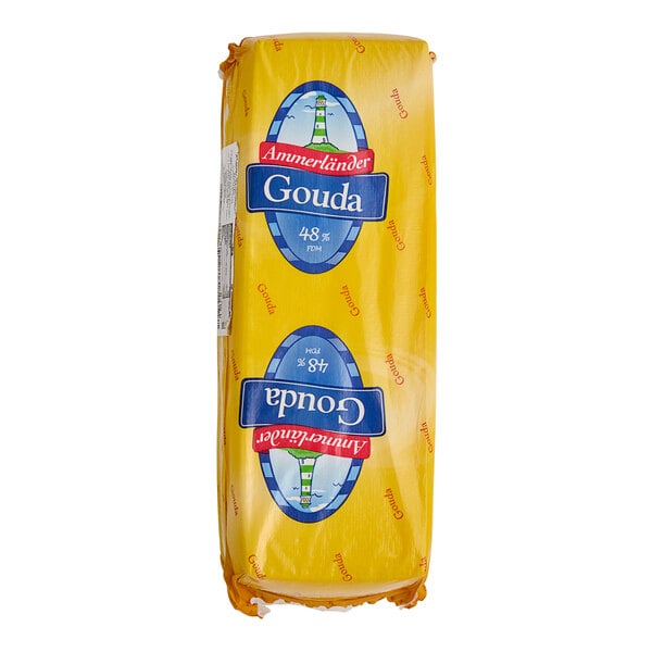 A yellow wrapped package of Ammerlander Gouda cheese on a white background.