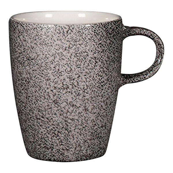 A RAK Porcelain dual porcelain coffee cup with a black speckled design.