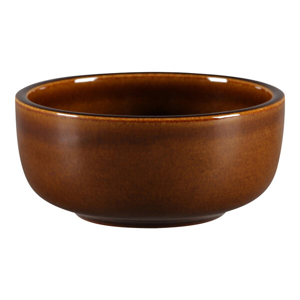 A brown Porcelain Ease ramekin with a black rim on a white background.