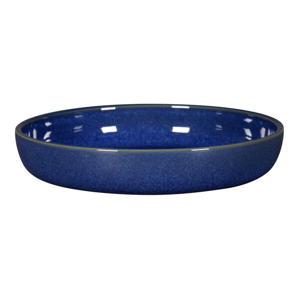 A RAK Porcelain cobalt blue porcelain plate with a speckled rim.