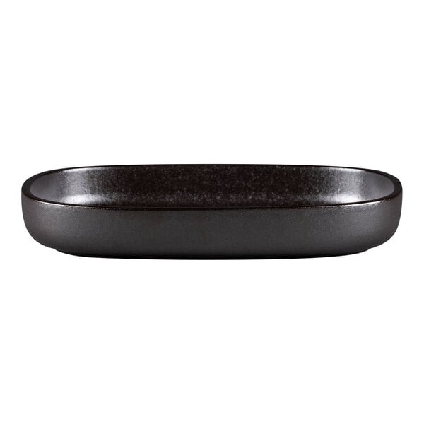 A black oval RAK Porcelain Forge deep porcelain plate with a dark brown rim.