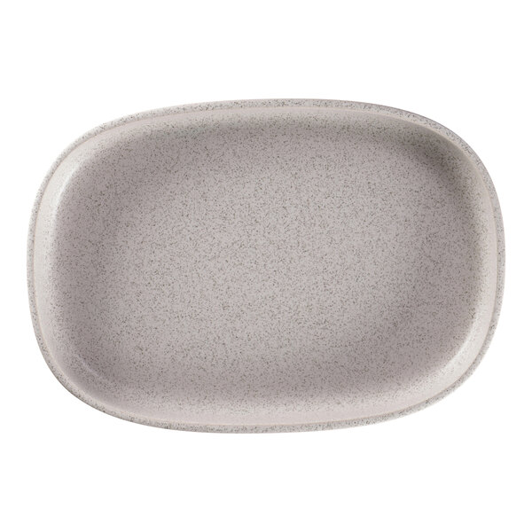 A close-up of a RAK Porcelain oval deep porcelain plate with a white rim.