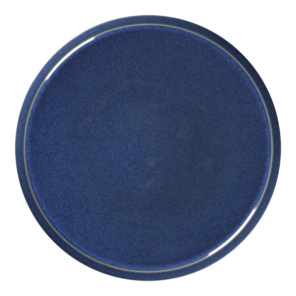 A cobalt blue porcelain plate with a white rim.