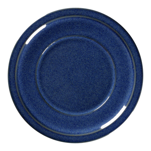 A cobalt blue porcelain plate with a silver rim.