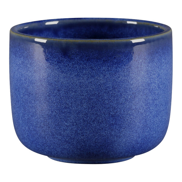 A cobalt blue porcelain bowl with a white background.