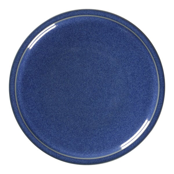 A blue porcelain plate with a white rim.