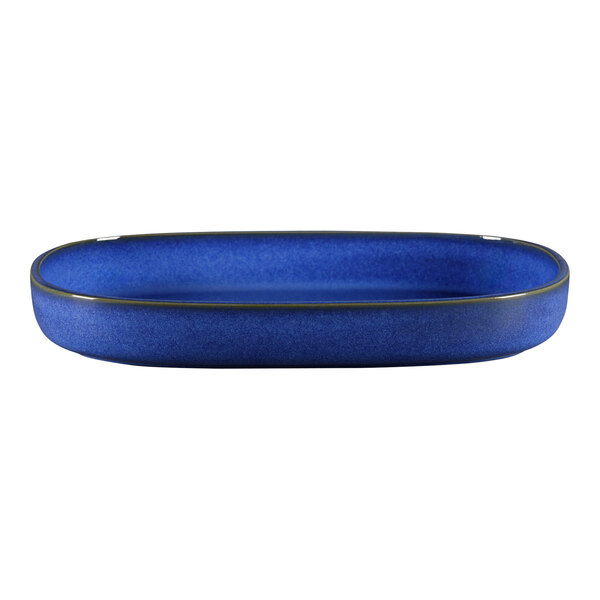 A blue oval porcelain dish with a black rim.