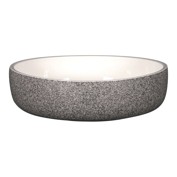 A RAK Porcelain dual bowl with a gray speckled surface and white rim.