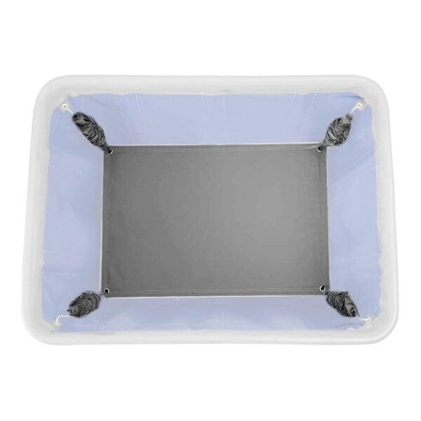 A white rectangular object with grey straps and blue platform springs.