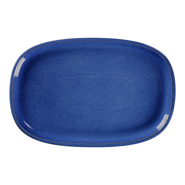 A blue oval RAK Porcelain plate with gold trim.