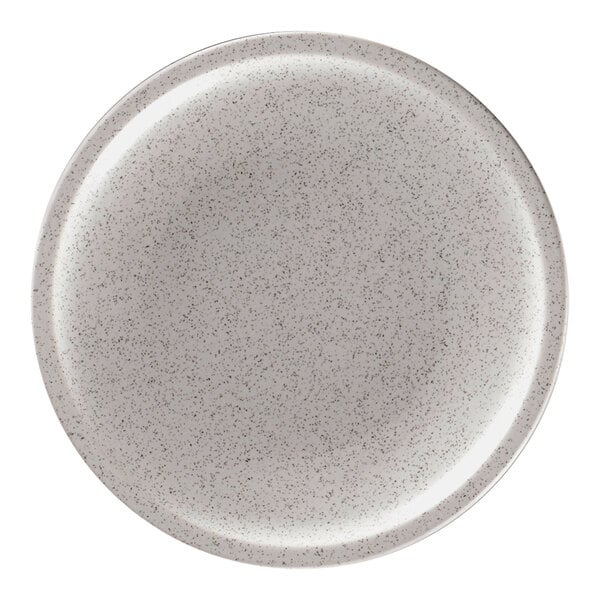 A close-up of a RAK Porcelain clay coupe plate with speckles.