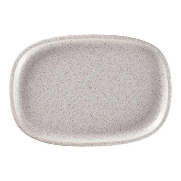 A white oval RAK Porcelain plate with speckled specks.