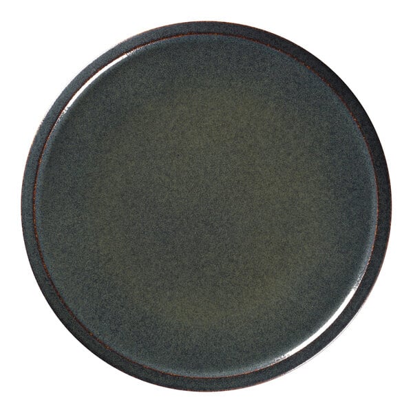 A close-up of a RAK Porcelain dark green porcelain plate with a brown rim.